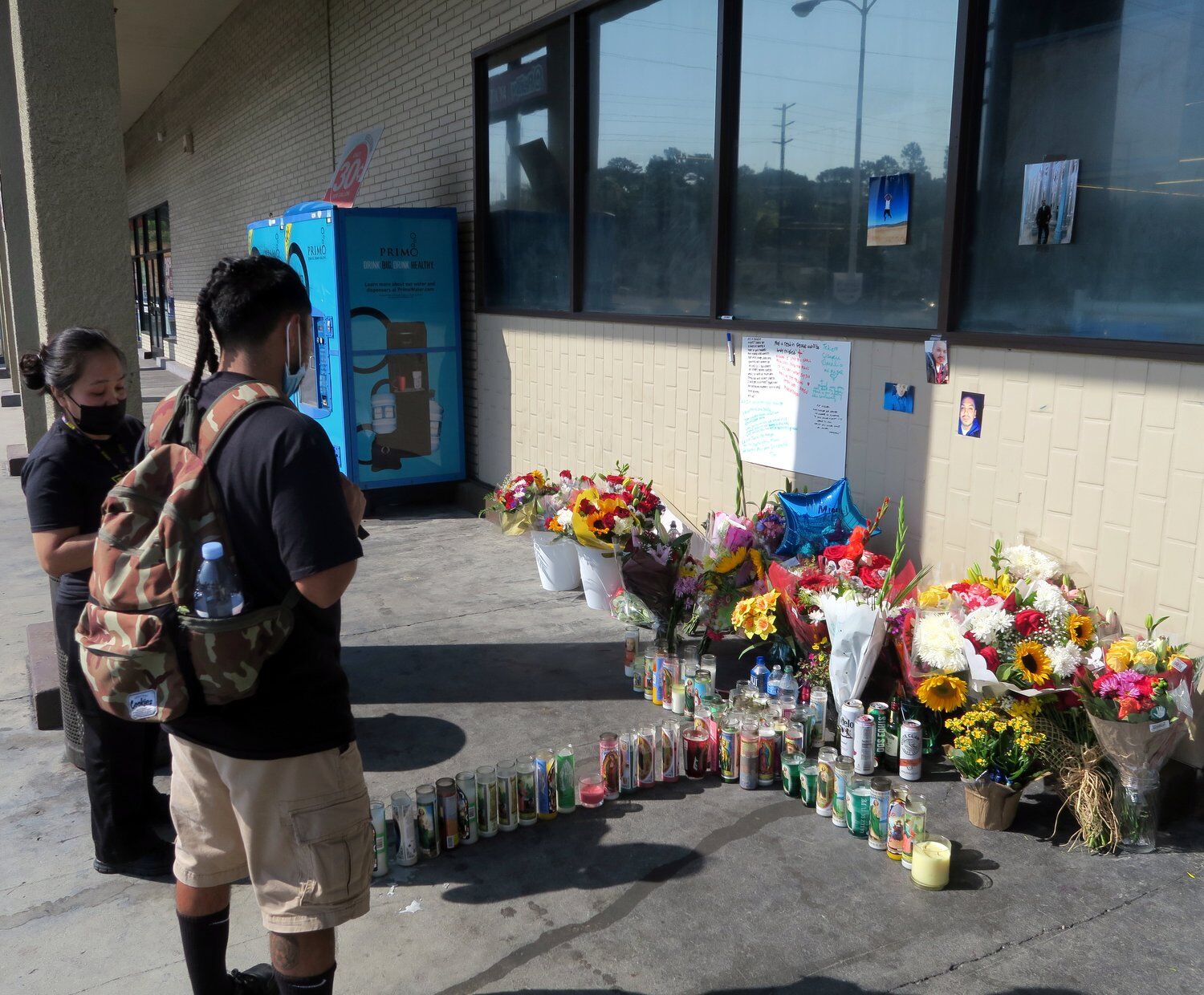 Rite Aid shooting memorial flowers and candles